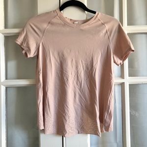 Blush Lululemon workout top with open back fold